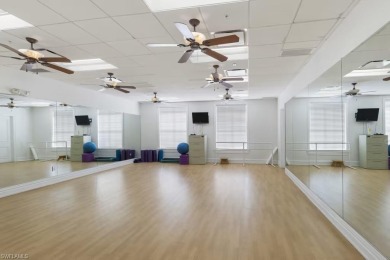 Enjoy low-maintenance, resort-style living in this beautifully on River Hall Country Club in Florida - for sale on GolfHomes.com, golf home, golf lot
