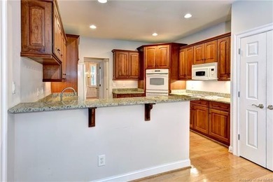 This classic brick Colonial offers enduring appeal paired with a on Fords Colony Country Club in Virginia - for sale on GolfHomes.com, golf home, golf lot