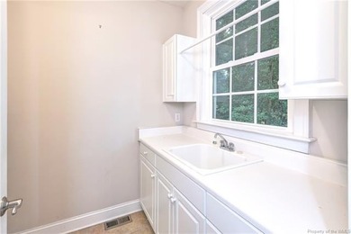 This classic brick Colonial offers enduring appeal paired with a on Fords Colony Country Club in Virginia - for sale on GolfHomes.com, golf home, golf lot