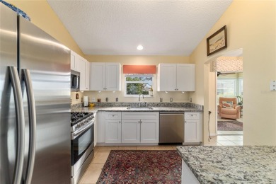 Welcome to this beautifully updated Banyan/Bougainvillea model on The Links of Spruce Creek in Florida - for sale on GolfHomes.com, golf home, golf lot