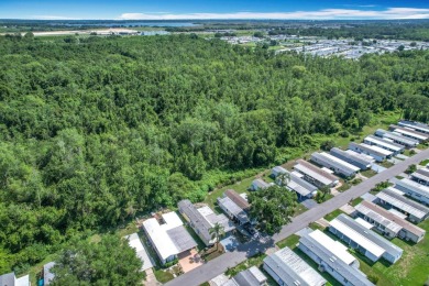 (Ver Espanol Abajo)  Lot rent $587 includes use of park on Lake Henry Golf Club in Florida - for sale on GolfHomes.com, golf home, golf lot