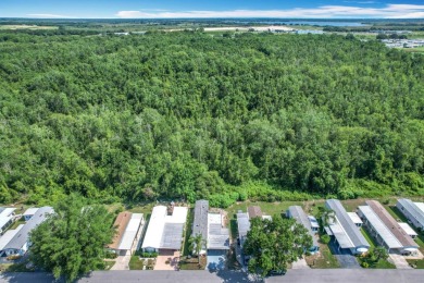 (Ver Espanol Abajo)  Lot rent $587 includes use of park on Lake Henry Golf Club in Florida - for sale on GolfHomes.com, golf home, golf lot