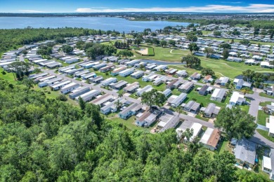 (Ver Espanol Abajo)  Lot rent $587 includes use of park on Lake Henry Golf Club in Florida - for sale on GolfHomes.com, golf home, golf lot