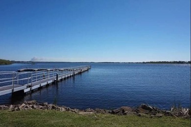 (Ver Espanol Abajo)  Lot rent $587 includes use of park on Lake Henry Golf Club in Florida - for sale on GolfHomes.com, golf home, golf lot