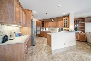 This elegant villa pool home offers 3,222 sf under air & 4,415 on Sailfish Point Golf Club, Inc. in Florida - for sale on GolfHomes.com, golf home, golf lot