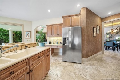 This elegant villa pool home offers 3,222 sf under air & 4,415 on Sailfish Point Golf Club, Inc. in Florida - for sale on GolfHomes.com, golf home, golf lot