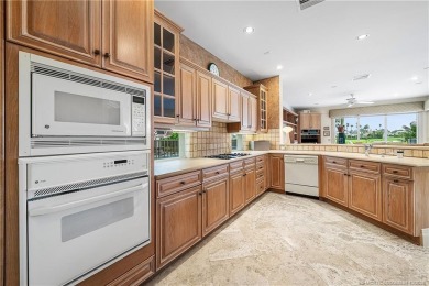 This elegant villa pool home offers 3,222 sf under air & 4,415 on Sailfish Point Golf Club, Inc. in Florida - for sale on GolfHomes.com, golf home, golf lot