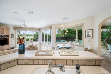 This elegant villa pool home offers 3,222 sf under air & 4,415 on Sailfish Point Golf Club, Inc. in Florida - for sale on GolfHomes.com, golf home, golf lot