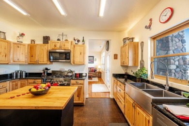 This stunning 4-Bedroom, 2.5 Bath home w/over 2,500 sq ft of on The Powder Horn Golf Club - Mountain in Wyoming - for sale on GolfHomes.com, golf home, golf lot