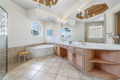This elegant villa pool home offers 3,222 sf under air & 4,415 on Sailfish Point Golf Club, Inc. in Florida - for sale on GolfHomes.com, golf home, golf lot