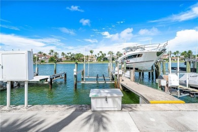 This elegant villa pool home offers 3,222 sf under air & 4,415 on Sailfish Point Golf Club, Inc. in Florida - for sale on GolfHomes.com, golf home, golf lot