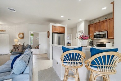 Enjoy your piece of Florida paradise in this charming 2-bedroom on Herons Glen Golf and Country Club in Florida - for sale on GolfHomes.com, golf home, golf lot