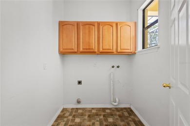 Home needs cosmetic updates and repair !! PRICE REFLECTS CURRENT on Wedgefield Golf Club in Florida - for sale on GolfHomes.com, golf home, golf lot