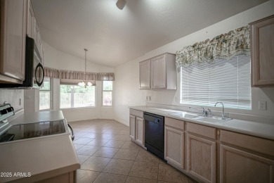Lovely 2 bed, 2 bath home with a den nestled in the highly on Coyote Lakes Golf Club in Arizona - for sale on GolfHomes.com, golf home, golf lot