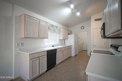 Lovely 2 bed, 2 bath home with a den nestled in the highly on Coyote Lakes Golf Club in Arizona - for sale on GolfHomes.com, golf home, golf lot