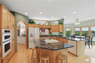 Perched at the top of a hill, this Victoria home offers peaceful on Deer Run Golf Club in Minnesota - for sale on GolfHomes.com, golf home, golf lot