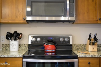 Welcome to this furnished 2-bedroom, 2-bathroom condo perched on on Headwaters Golf Course At Granby Ranch in Colorado - for sale on GolfHomes.com, golf home, golf lot