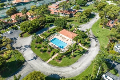Nestled in a secluded tropical enclave of the Sandpiper section on Quail Ridge Golf Course and Country Club in Florida - for sale on GolfHomes.com, golf home, golf lot