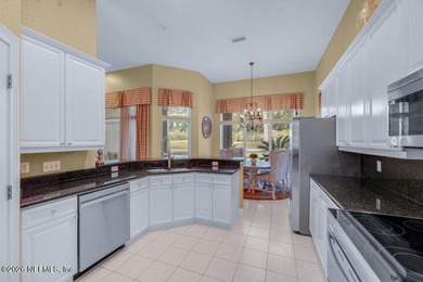 The epitome of luxurious, country club living, nestled within on Country Club of Orange Park in Florida - for sale on GolfHomes.com, golf home, golf lot