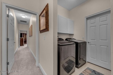 The epitome of luxurious, country club living, nestled within on Country Club of Orange Park in Florida - for sale on GolfHomes.com, golf home, golf lot