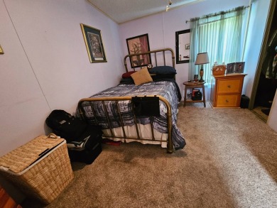 Please note; buyers do not own the land. This 2-bedroom, 2 bath on Big Cypress Golf and Country Club in Florida - for sale on GolfHomes.com, golf home, golf lot