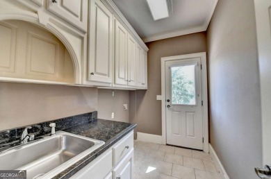 Stunning 5 bed/5.5 bath MASTER-ON-MAIN, 4-side BRICK home with on Laurel Springs Golf Club in Georgia - for sale on GolfHomes.com, golf home, golf lot