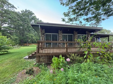 NEW LISTING!! This residence offers diverse possibilities on Cherokee Village South Course in Arkansas - for sale on GolfHomes.com, golf home, golf lot