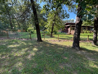 NEW LISTING!! This residence offers diverse possibilities on Cherokee Village South Course in Arkansas - for sale on GolfHomes.com, golf home, golf lot