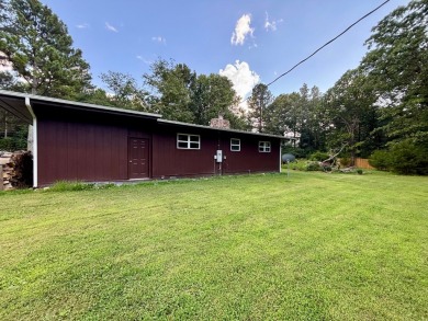 NEW LISTING!! This residence offers diverse possibilities on Cherokee Village South Course in Arkansas - for sale on GolfHomes.com, golf home, golf lot