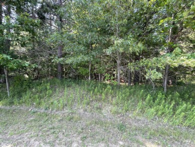 This remarkable 0.83 +/- acre wooded lot is a nature lover's on Thunder Bay Golf Resort in Michigan - for sale on GolfHomes.com, golf home, golf lot