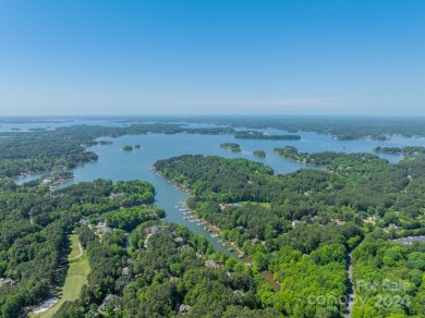 Step into your dream lake lifestyle this summer with this on Trump National Golf Club Charlotte in North Carolina - for sale on GolfHomes.com, golf home, golf lot