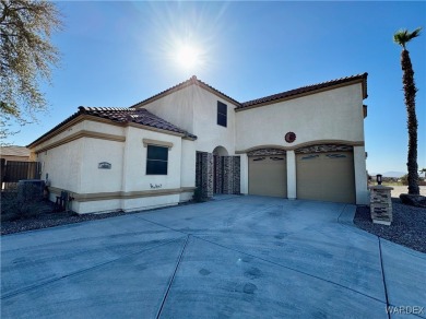 This spacious 2-story custom pool home in the gated Los Lagos on Los Lagos Golf Club in Arizona - for sale on GolfHomes.com, golf home, golf lot