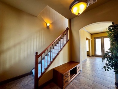 This spacious 2-story custom pool home in the gated Los Lagos on Los Lagos Golf Club in Arizona - for sale on GolfHomes.com, golf home, golf lot