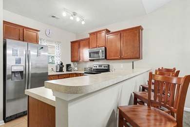 This furnished third-floor two-bedroom, two-bathroom condo is on Barefoot Resort and Golf Club  in South Carolina - for sale on GolfHomes.com, golf home, golf lot