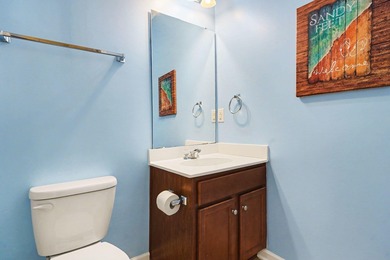 This furnished third-floor two-bedroom, two-bathroom condo is on Barefoot Resort and Golf Club  in South Carolina - for sale on GolfHomes.com, golf home, golf lot