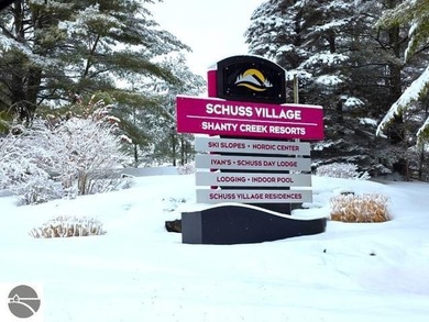 Comfortable in all seasons, this 2-bedroom condominium has on  in Michigan - for sale on GolfHomes.com, golf home, golf lot