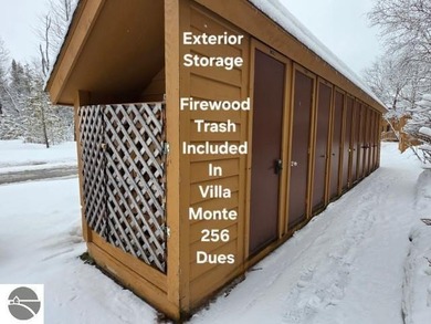 Comfortable in all seasons, this 2-bedroom condominium has on  in Michigan - for sale on GolfHomes.com, golf home, golf lot