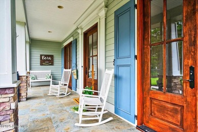 This stunning Creekside home offers front-row views of the on Crow Creek Golf Club in North Carolina - for sale on GolfHomes.com, golf home, golf lot