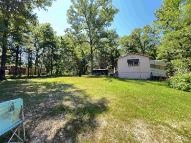 Discover this delightful 2 bed 1 bath 956 sq. ft. home on Cherokee Village North Course in Arkansas - for sale on GolfHomes.com, golf home, golf lot