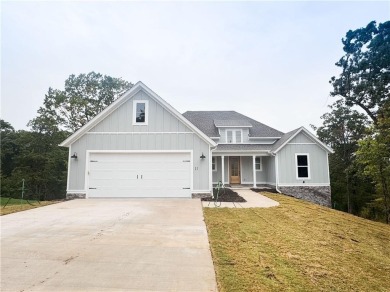 This home features beautiful woods floors throughout the home on Branchwood Golf Course in Arkansas - for sale on GolfHomes.com, golf home, golf lot