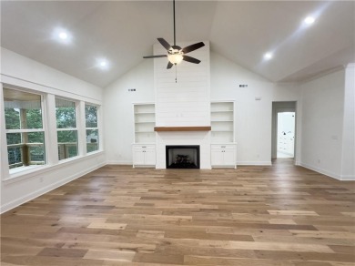 This home features beautiful woods floors throughout the home on Branchwood Golf Course in Arkansas - for sale on GolfHomes.com, golf home, golf lot