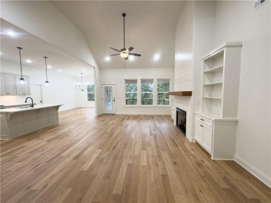 This home features beautiful woods floors throughout the home on Branchwood Golf Course in Arkansas - for sale on GolfHomes.com, golf home, golf lot