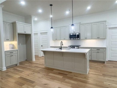 This home features beautiful woods floors throughout the home on Branchwood Golf Course in Arkansas - for sale on GolfHomes.com, golf home, golf lot