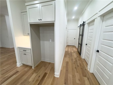 This home features beautiful woods floors throughout the home on Branchwood Golf Course in Arkansas - for sale on GolfHomes.com, golf home, golf lot