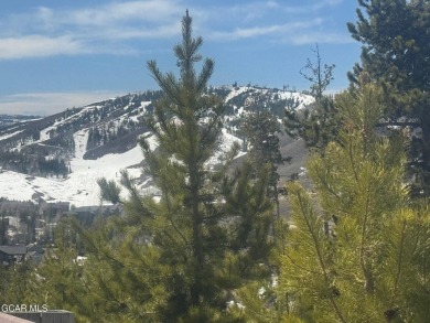 Nestled on the ridge with stunning views of open space, this on Headwaters Golf Course At Granby Ranch in Colorado - for sale on GolfHomes.com, golf home, golf lot