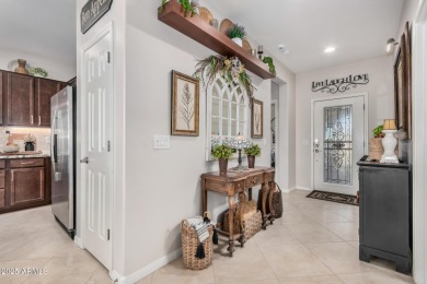 Custom lead glass entry sets the tone for this stunning duet on  in Arizona - for sale on GolfHomes.com, golf home, golf lot