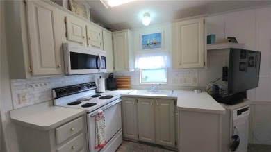 UPDATED SINGLE WIDE MOBILE HOME IN ACTIVE 55+ COMMUNITY! Stay on River Run Golf Links in Florida - for sale on GolfHomes.com, golf home, golf lot