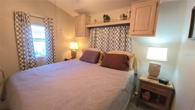UPDATED SINGLE WIDE MOBILE HOME IN ACTIVE 55+ COMMUNITY! Stay on River Run Golf Links in Florida - for sale on GolfHomes.com, golf home, golf lot