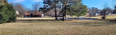 Nestled on a scenic lot along the 18 hole golf course in on Holiday Island Golf Course in Arkansas - for sale on GolfHomes.com, golf home, golf lot
