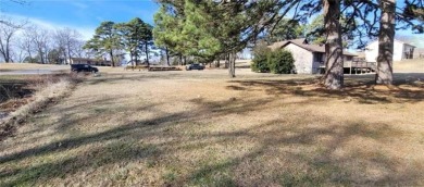 Nestled on a scenic lot along the 18 hole golf course in on Holiday Island Golf Course in Arkansas - for sale on GolfHomes.com, golf home, golf lot